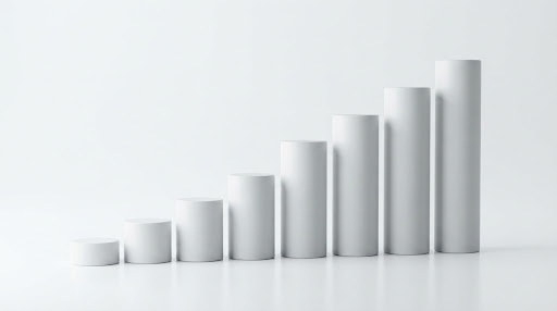 Matte cylindrical pillars ascending in a staircase pattern against a stark white background, softly lit.